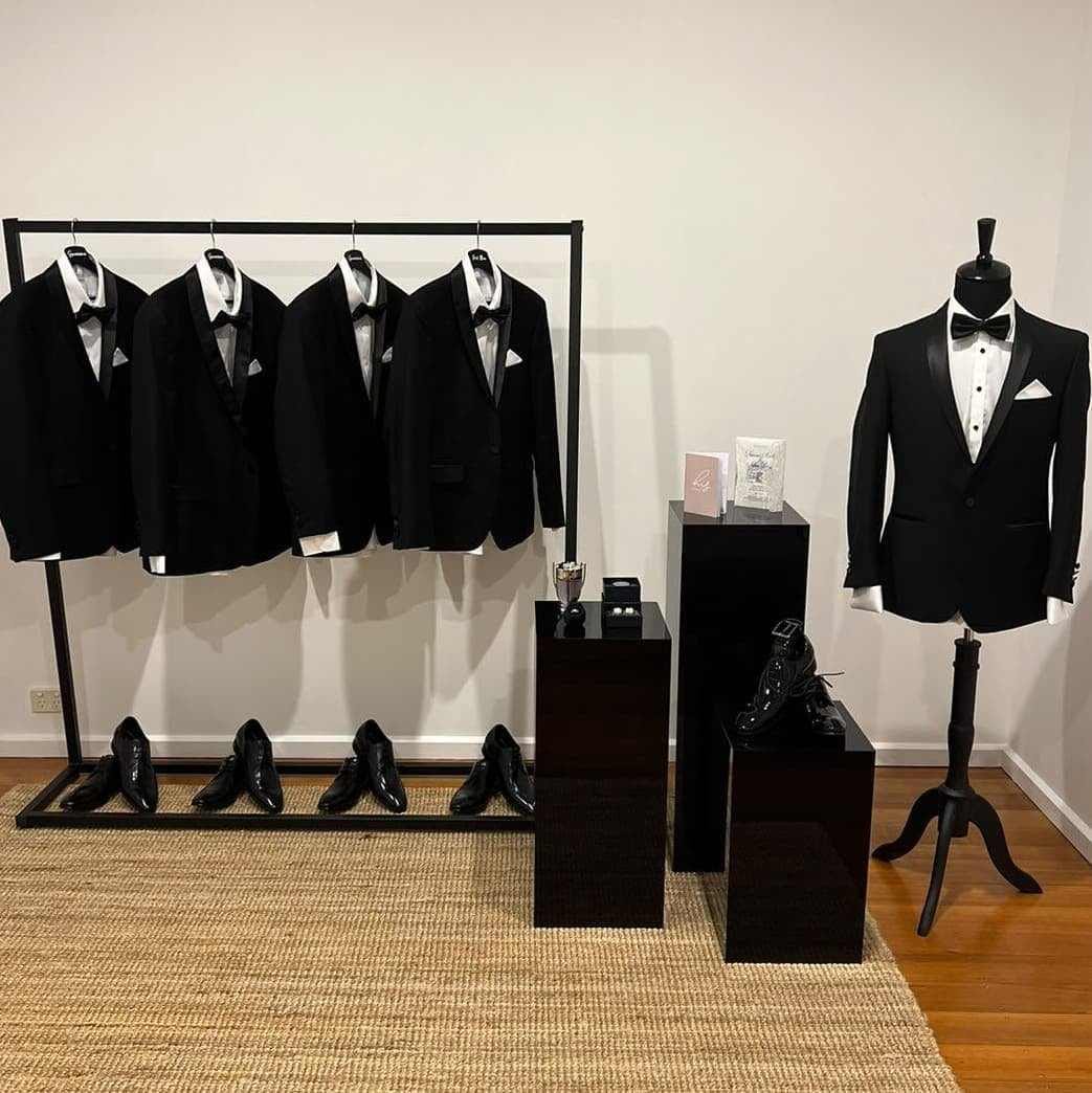 Full groom room with suits, mannequin and plinths