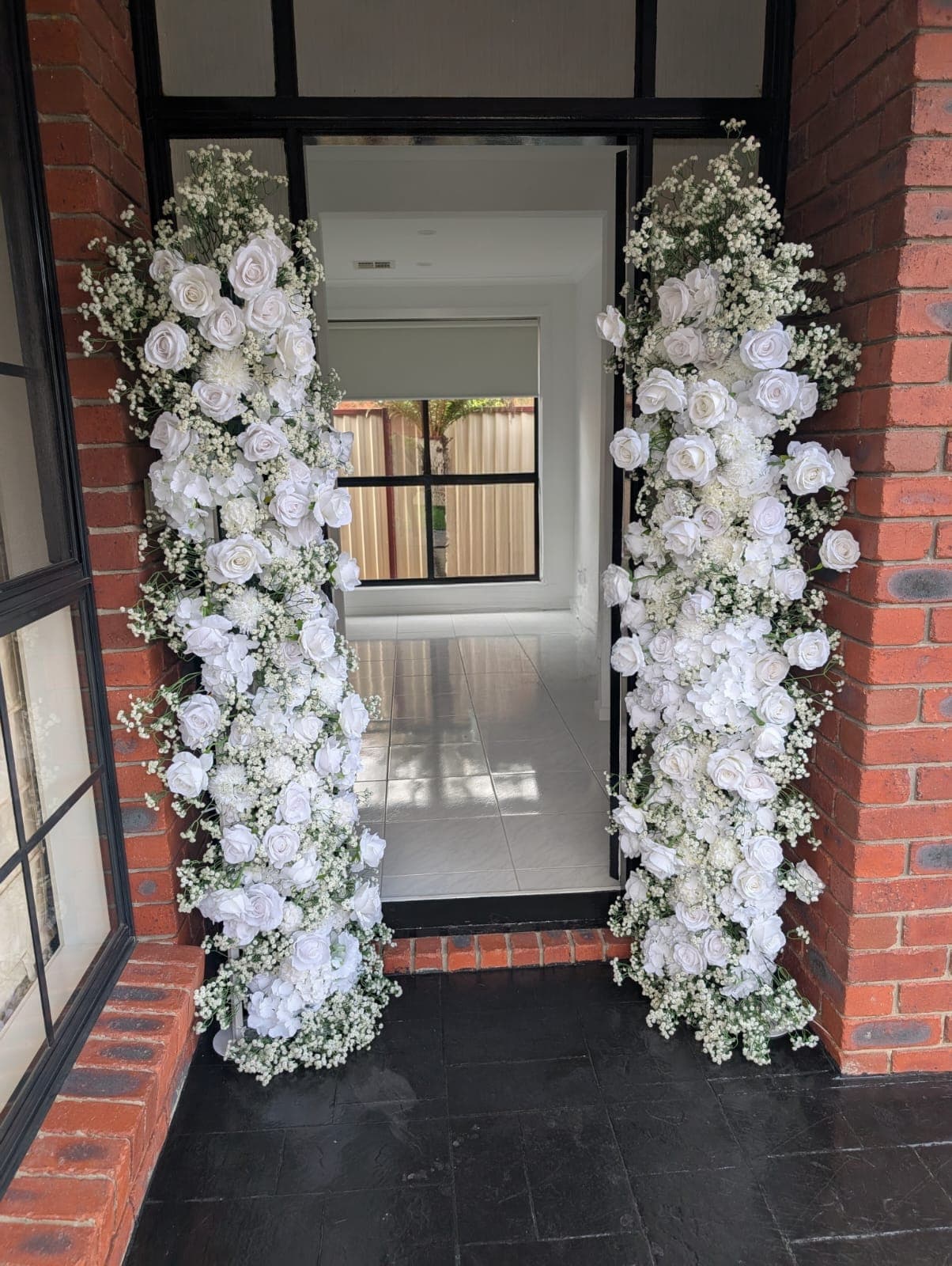 Entrance framed by floral columns